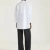 Camisa asimétrica de popelín con lentejuelas