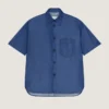 Camisa con costuras de alta costura en denim azul índigo con estampado Givenchy