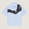 Camisa de popelín con estampado surrealista Camisa de popelín con estampado surrealista