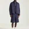 Chaqueta con costuras de alta costura en denim bordado con «Givenchy Paris»