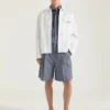 Chaqueta con costuras de alta costura en denim bordado con «Givenchy Paris»