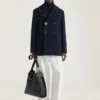 Bolso hobo mediano con cinturón en piel granulada Bolso hobo mediano con cinturón en piel granulada