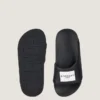 Mules planas Label de goma Mules planas Label de goma