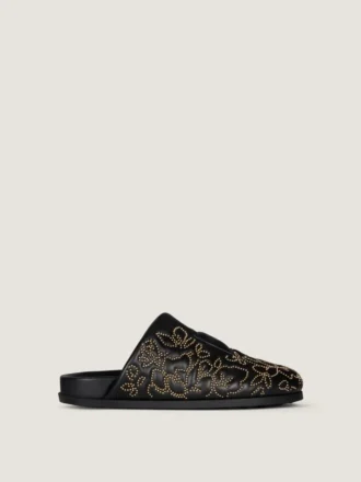 Mules planos Label de piel con tachuelas