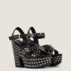 Sandalias de plataforma tipo zueco de piel con tachuelas