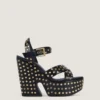 Sandalias de plataforma tipo zueco de piel con tachuelas