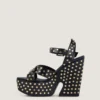 Sandalias de plataforma tipo zueco de piel con tachuelas