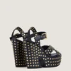 Sandalias de plataforma tipo zueco de piel con tachuelas