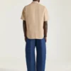Vaqueros azul índigo con costuras de alta costura y estampado del sello de Givenchy